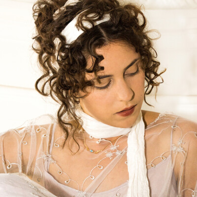 Enter the enchanting world of the Regency era with Hannah R. and her exquisite Empire hair and make-up from 1805-1810. Every curl and ribbon, meticulously crafted by hairstylist, make-up artist and photographer Anett Alexandra Bulano, transports us to a bygone era of grace and refinement. #RegencyReverie #EmpireElegance πΉπβ¨ Close-up portrait of model Hannah R. featuring an Empire Regency hairstyle and period make-up from 1805-1810. Inspired by ancient Roman influences, the hairstyle features intricate curls and delicate ribbons, perfectly capturing the elegance of the era. Photographed by Anett Alexandra Bulano.
