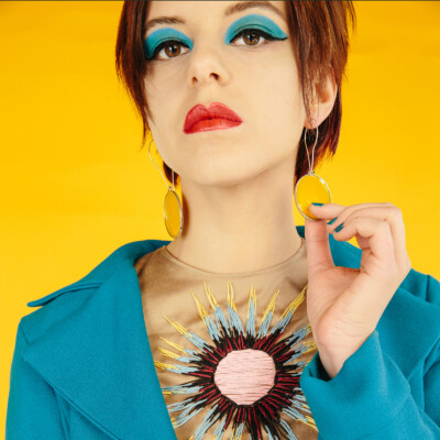 Step back in time to the swinging sixties with Ada K. as she channels the playful charm and vibrant style of the era. With bold colours and retro flair, this image captures the essence of pop art chic. #1960sStyle #PopArt #VintageVibes πΌπ¨βοΈ Featuring model Ada K. in a vivid ensemble inspired by the 1960s on a yellow background. Her sky-blue make-up and retro hairstyle complement the pop-art theme. Photographed by Nailya Bikmurzina.