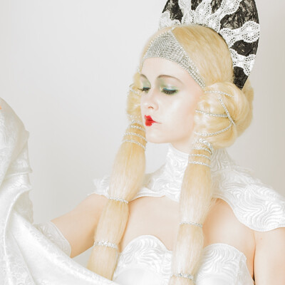 Journey back in time to the Roaring Twenties with Lena D. as she embodies the elegance of ErtΓ©-inspired beauty. Hair, makeup, and photography by Anett Alexandra Bulano. π«β¨ #ErtΓ©Elegance #1920sGlamour #EditorialBeauty Editorial beauty portrait of model Lena D. adorned in ErtΓ©-inspired attire, featuring intricate hair styling and glamorous 1920s makeup.